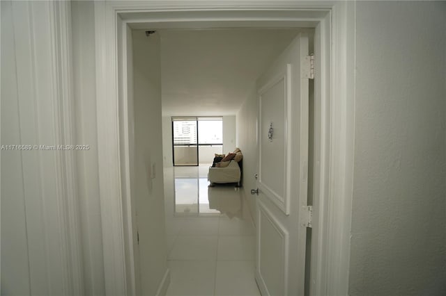 hall featuring tile patterned flooring