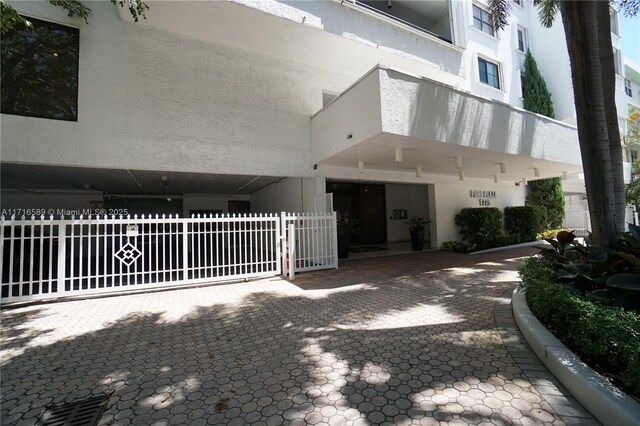 view of gate featuring fence