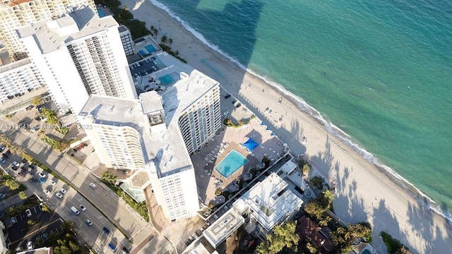 aerial view featuring a view of the beach and a water view