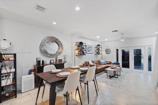 dining room featuring french doors, ceiling fan, and light tile patterned flooring