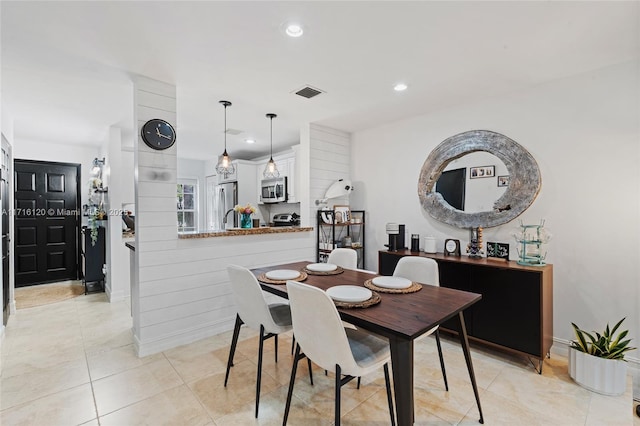 dining space with light tile patterned floors