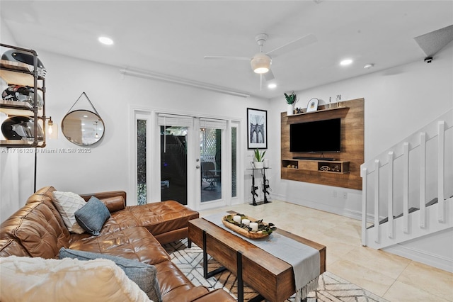 tiled living room featuring ceiling fan and french doors