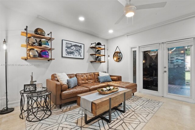 living room featuring ceiling fan and light tile patterned flooring