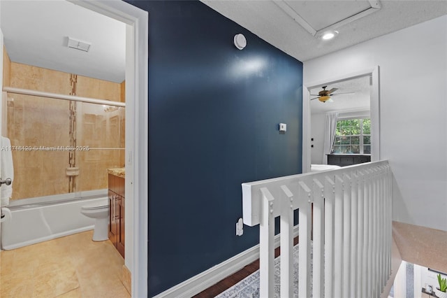 hallway featuring a textured ceiling