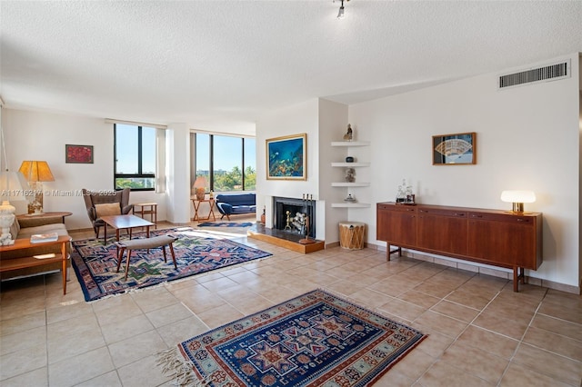 tiled living room with a textured ceiling