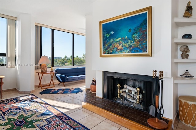 tiled living room with built in features and a fireplace