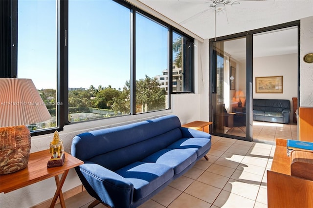 sunroom featuring ceiling fan