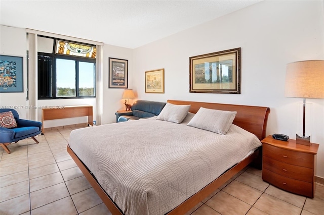 bedroom featuring light tile patterned flooring