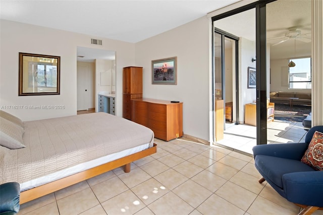 bedroom with ceiling fan and light tile patterned floors