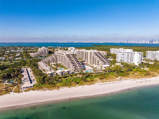 aerial view with a water view and a view of the beach