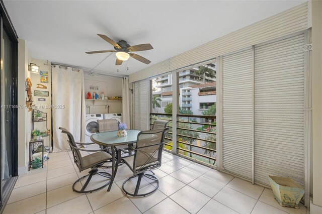 tiled dining area featuring ceiling fan and separate washer and dryer