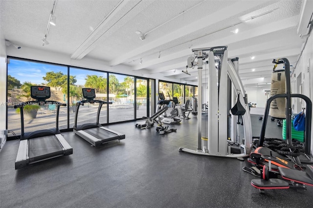 exercise room featuring a textured ceiling