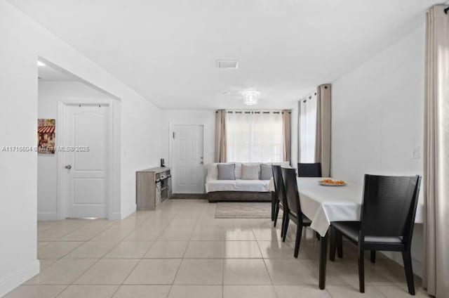 dining area featuring light tile patterned floors