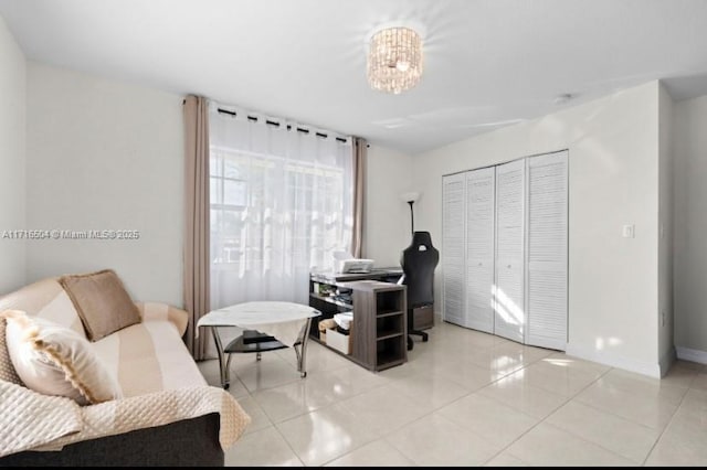 office featuring a notable chandelier and light tile patterned floors