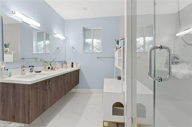 bathroom featuring vanity and a shower with shower door