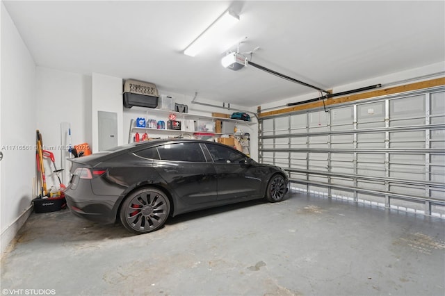 garage with electric panel and a garage door opener