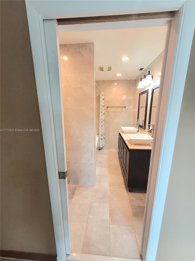 bathroom featuring tile patterned flooring and vanity