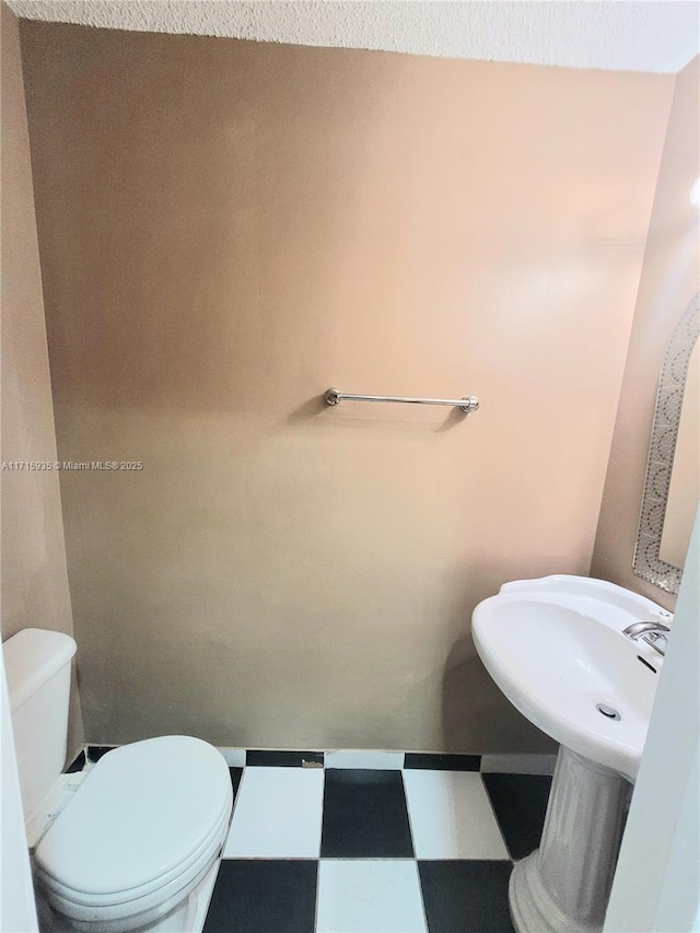 bathroom featuring toilet