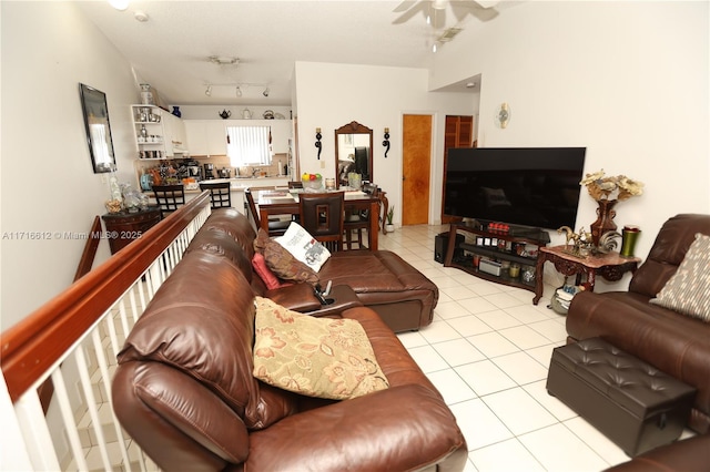 living room with ceiling fan, light tile patterned flooring, and track lighting