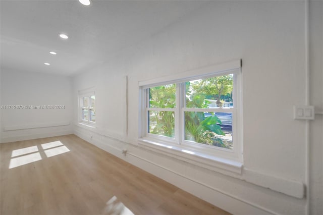 spare room with light hardwood / wood-style floors