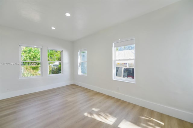 unfurnished room with light hardwood / wood-style floors