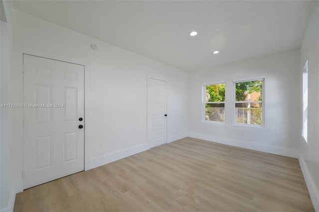 spare room featuring light hardwood / wood-style floors