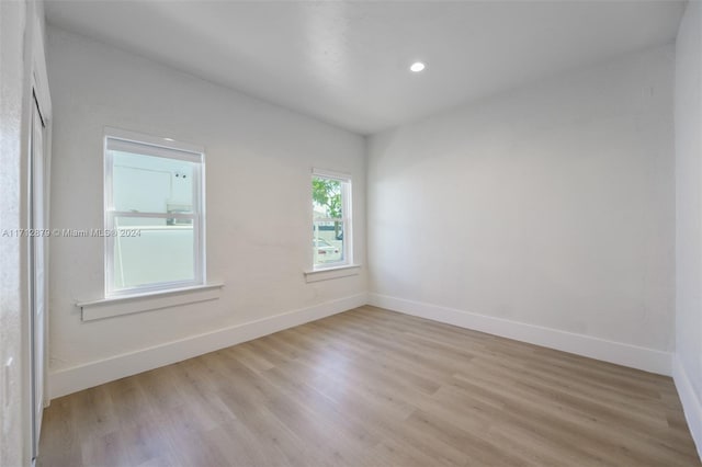 empty room with light hardwood / wood-style floors