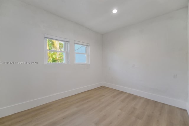 spare room featuring light wood-type flooring