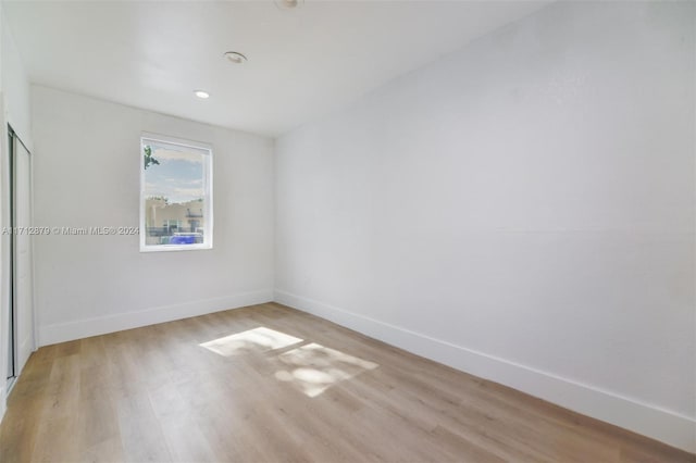 unfurnished room featuring light hardwood / wood-style flooring