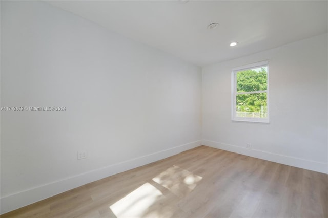 unfurnished room with light hardwood / wood-style floors