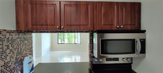 kitchen with stove, backsplash, and heating unit