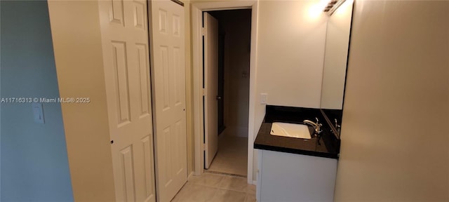 bathroom featuring tile patterned flooring and vanity