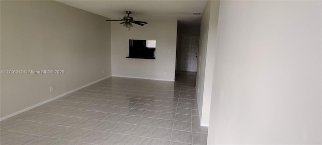 tiled empty room with ceiling fan