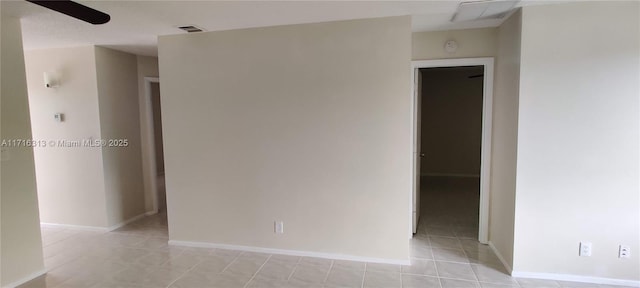 empty room with light tile patterned floors