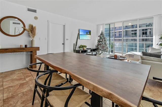 dining room with a wall of windows