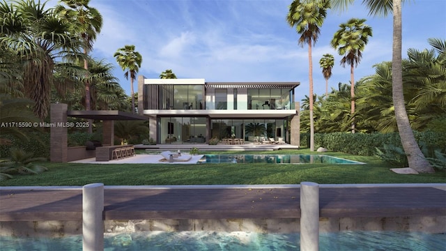 back of house featuring a yard, a balcony, and a patio