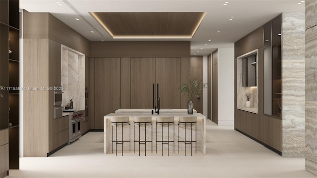 hallway with sink and light tile patterned floors