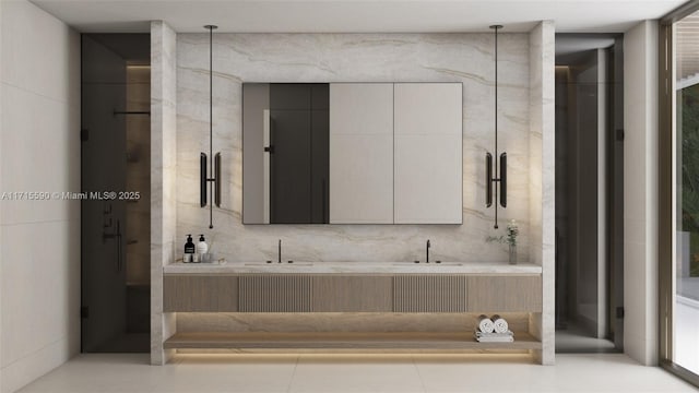 bathroom featuring tile patterned flooring, vanity, and walk in shower