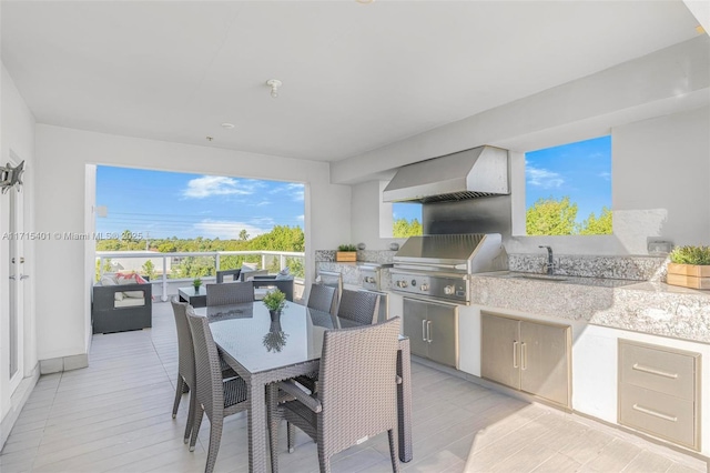6671 NW 105th Pl Unit 6671, Doral, FL 33178 - view of patio featuring a sink, grilling area, an outdoor hangout area, and an outdoor kitchen