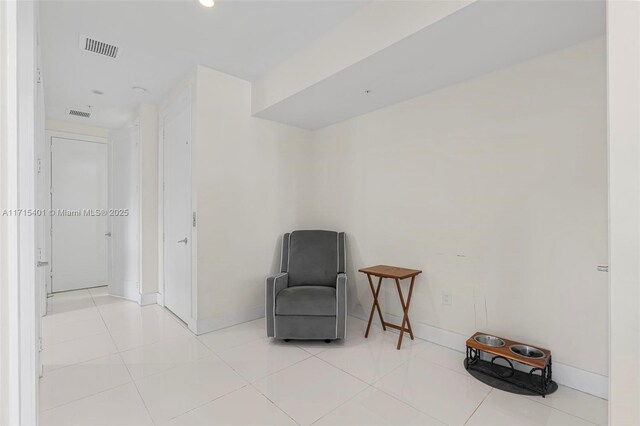 living area with light tile patterned floors