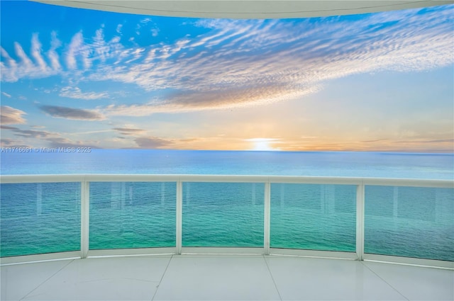 balcony at dusk with a water view