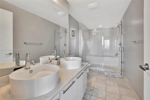 bathroom with vanity and walk in shower