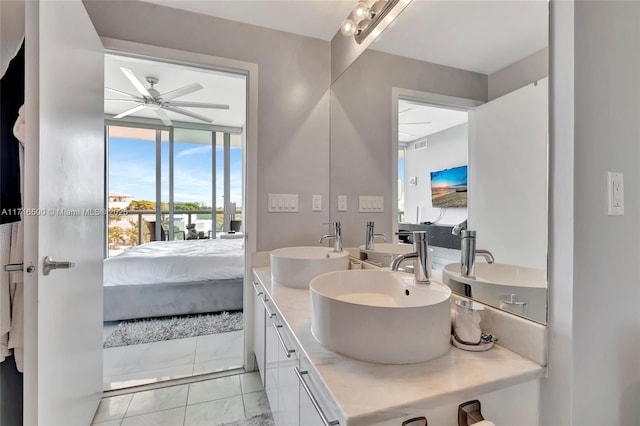 bathroom with ceiling fan and vanity