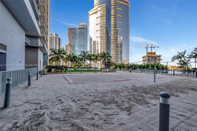 view of home's community featuring volleyball court