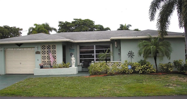 single story home with a garage and a front lawn