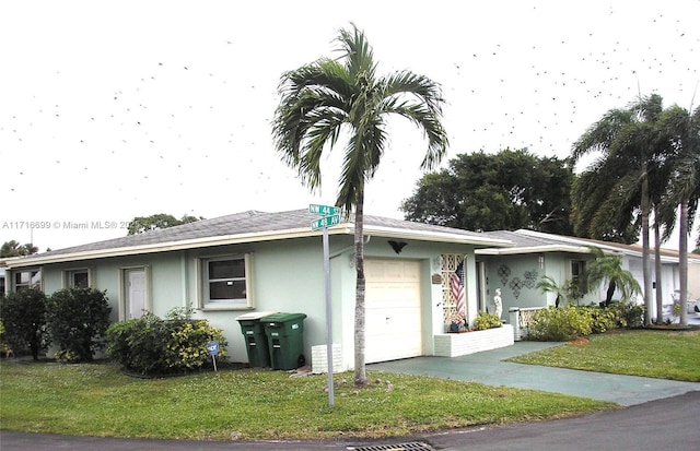 ranch-style house with a garage and a front lawn