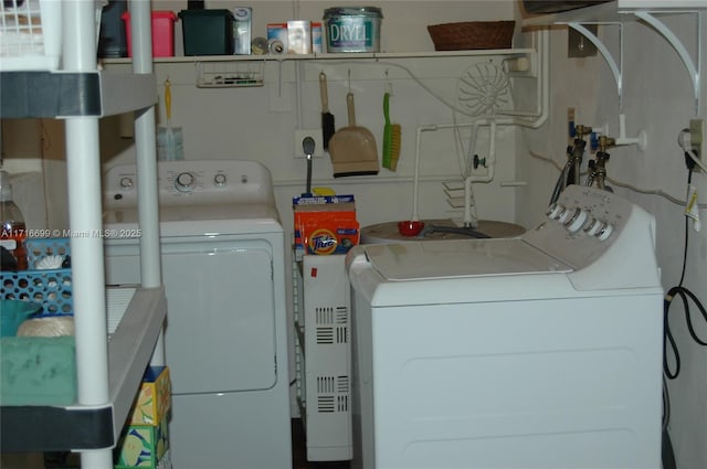 laundry area with independent washer and dryer