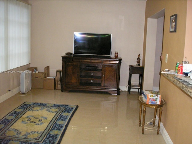 living room with light tile patterned flooring