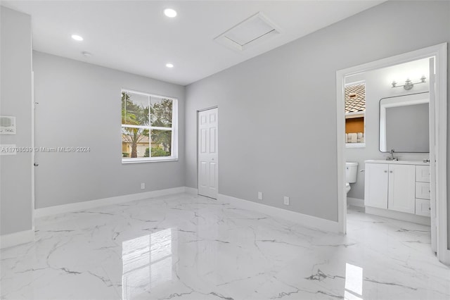 unfurnished room featuring sink