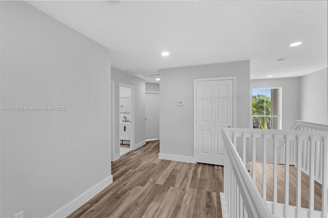 corridor featuring light hardwood / wood-style flooring